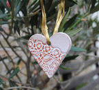 Ceramic heart for hanging with a lace pattern