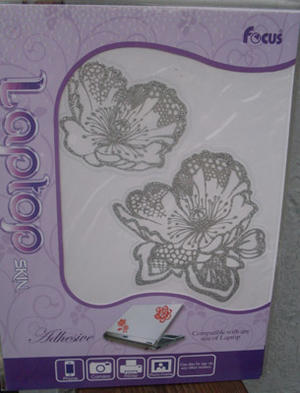 Laptop skin flower bling.