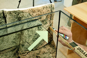 Glue on the back of the Slimline section.