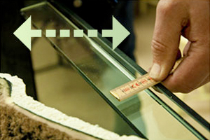 Place a thin line of silicon on the backside of the overlapping section.