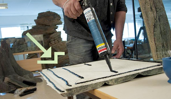 Place a thin line of silicon on the backside of the overlapping section.