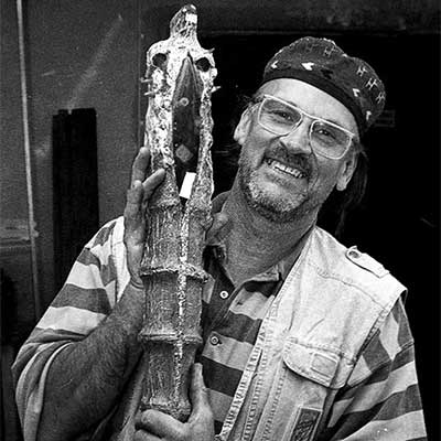 Bertil Vallien holding a unique sculpture