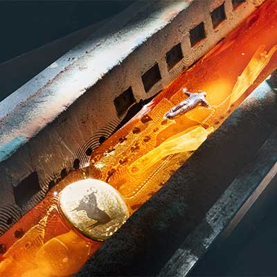 Glowing glass mass in the sand mold