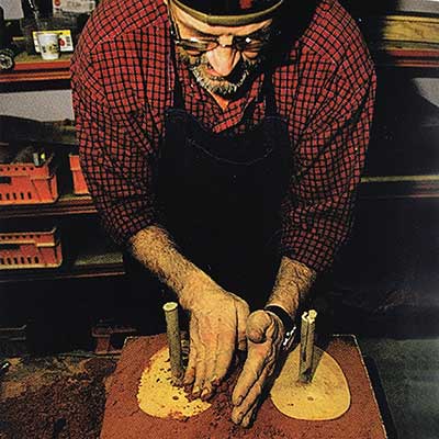Bertil Vallien shapes the casting sand with wooden models
